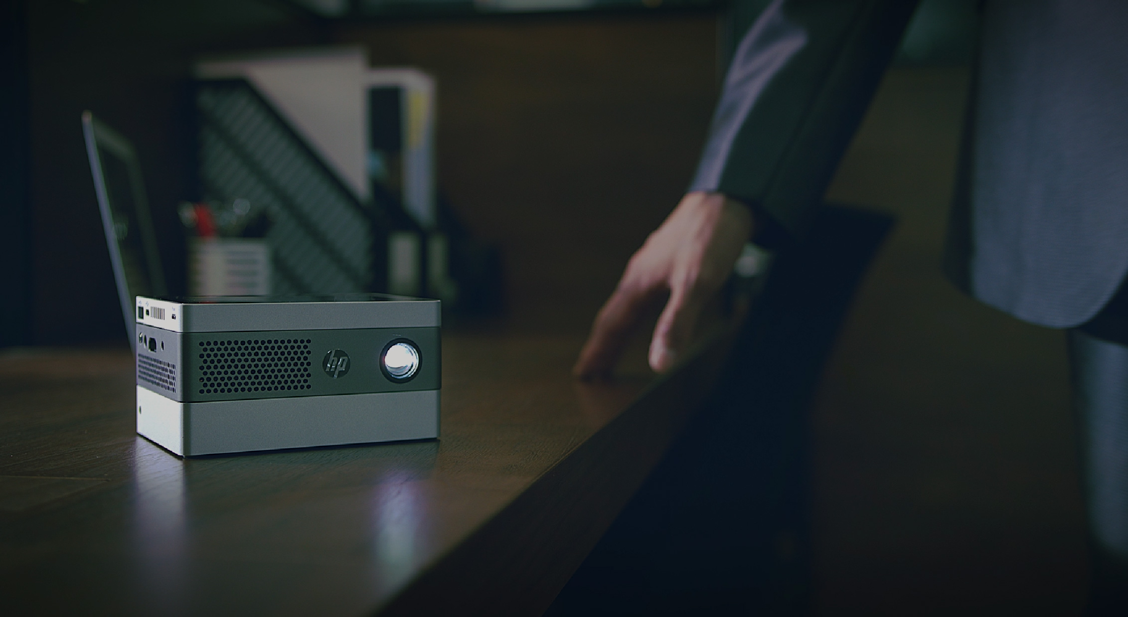 HP IP400 on a Wooden Table Next to a Man Touching the Table